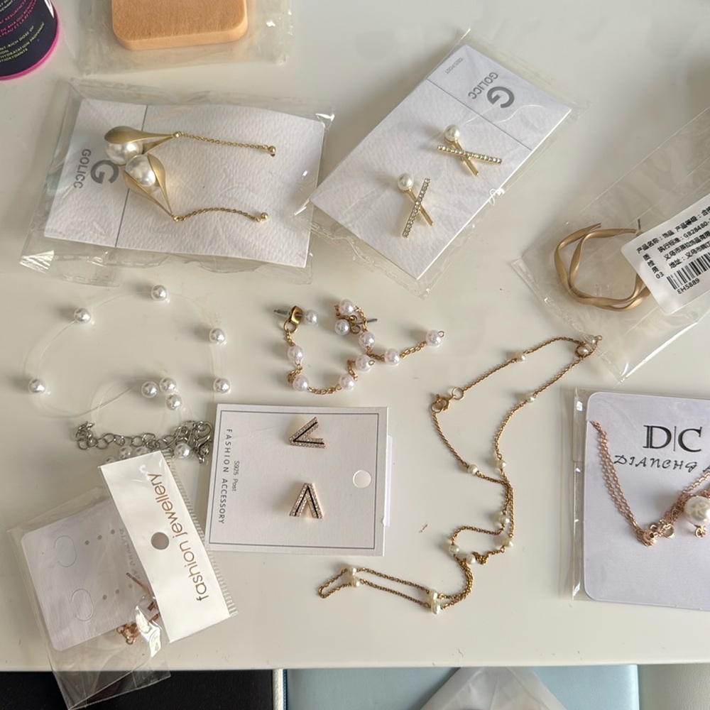 6 earrings and two necklaces